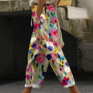 Carlijn | Kleurrijke bloemenprint broek met zakken